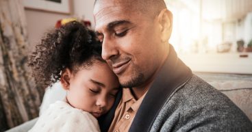 Father holding daughter in loving embrace - communicating Family Law services at Yarn Legal