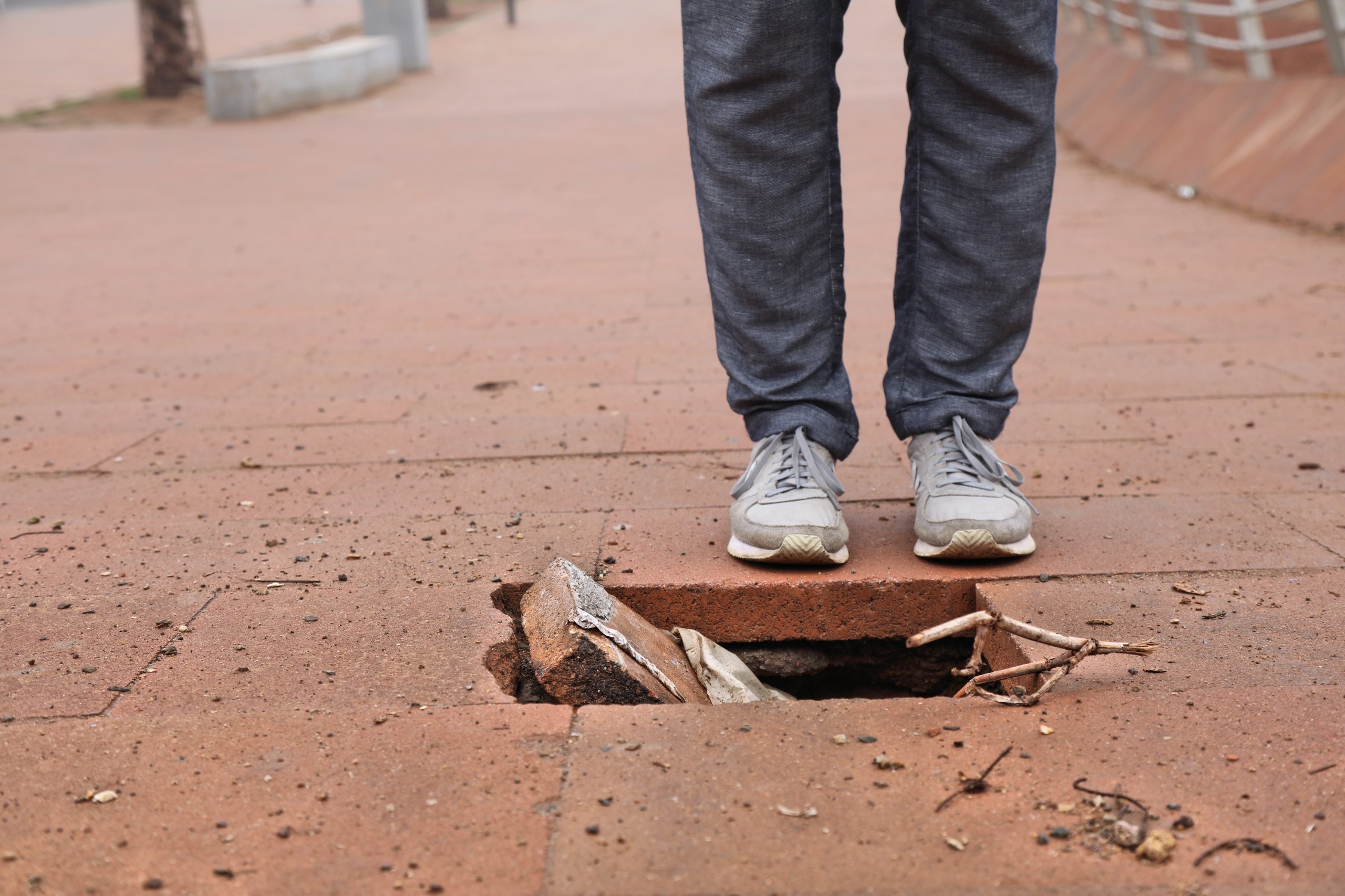 Damaged pavement – city sidewalk problem